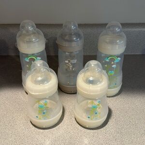 MAM Baby Bottles! Size 1 and 2 Nipples. One bottle without nipple.